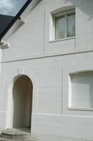 Réalisation des façades en pierre de taille sur une maison neuve proche Etretat